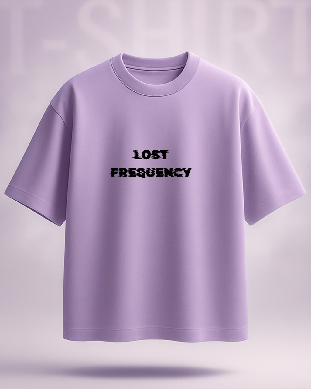 Purple t-shirt with 'LOST FREQUENCY' text on a light purple background